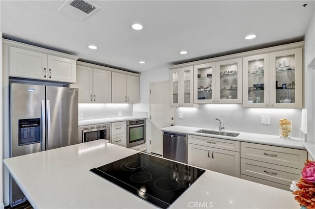 2146 Via Aguila, San Clemente, CA 92673 - kitchen with a sink, appliances with stainless steel finishes, white cabinetry, recessed lighting, and light countertops