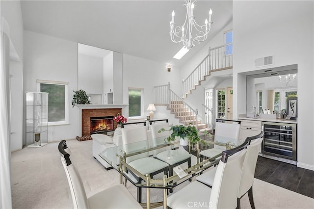 2146 Via Aguila, San Clemente, CA 92673 - dining area with wine cooler, a chandelier, a towering ceiling, healthy amount of natural light, and stairway
