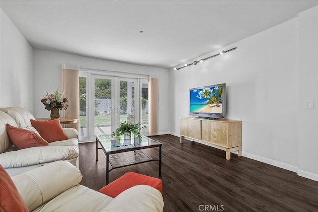 2146 Via Aguila, San Clemente, CA 92673 - living area featuring rail lighting, wood finished floors, and baseboards