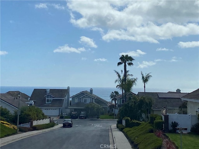 2146 Via Aguila, San Clemente, CA 92673 - view of asphalt road featuring curbs, a residential view, a water view, and sidewalks