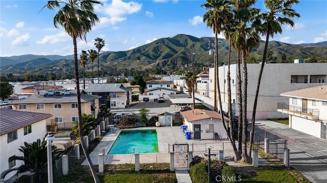 2004 Palm Ave, Highland, CA 92346 - community pool with a residential view, a mountain view, and fence