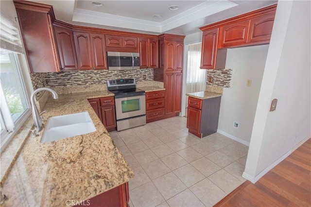 21049 Silver Cloud Dr, Diamond Bar, CA 91765 - kitchen with stainless steel appliances, a sink, decorative backsplash, dark brown cabinets, and ornamental molding