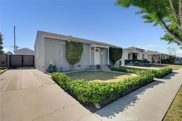 6119 Eastbrook Ave, Lakewood, CA 90713 - view of front of property with a gate and stucco siding