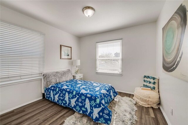 5642 Briercrest Ave, Lakewood, CA 90713 - bedroom featuring wood finished floors and baseboards