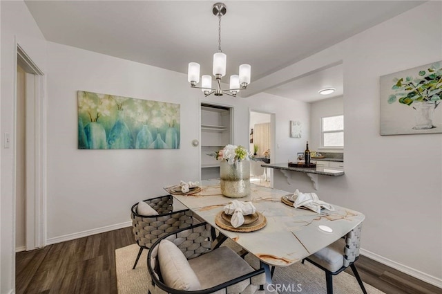 5642 Briercrest Ave, Lakewood, CA 90713 - dining room with wood finished floors, a chandelier, and baseboards