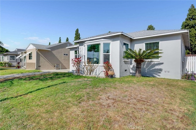 5642 Briercrest Ave, Lakewood, CA 90713 - view of front of property featuring stucco siding and a front yard