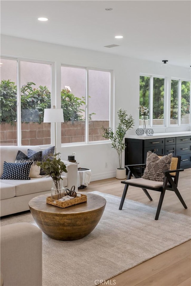 17 Candlewood, Irvine, CA 92620 - living area featuring light wood-style flooring, recessed lighting, and baseboards