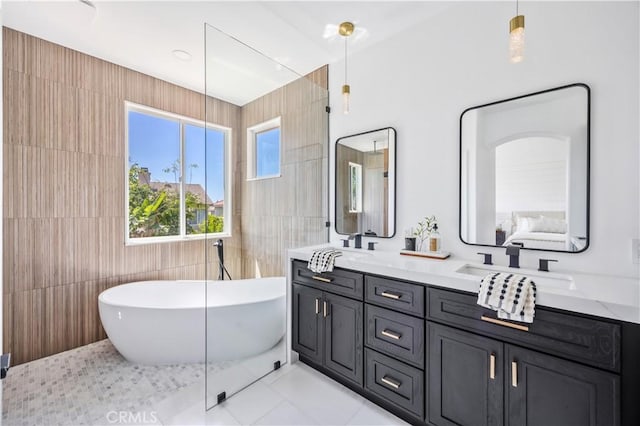 17 Candlewood, Irvine, CA 92620 - full bath with tile walls, a freestanding tub, tile patterned flooring, and double vanity