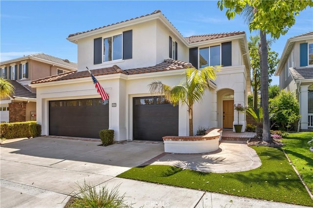 17 Candlewood, Irvine, CA 92620 - view of front of house with a tile roof, stucco siding, an attached garage, and driveway