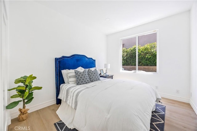 17 Candlewood, Irvine, CA 92620 - bedroom featuring baseboards and light wood finished floors