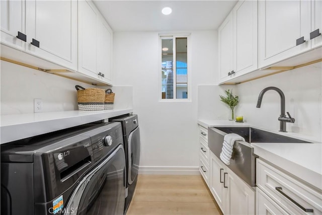 17 Candlewood, Irvine, CA 92620 - clothes washing area with washing machine and clothes dryer, baseboards, light wood-style flooring, cabinet space, and recessed lighting