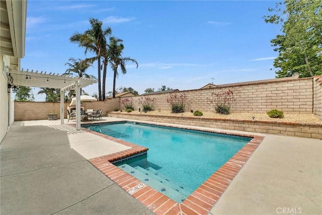 view of swimming pool with a patio, a fenced backyard, a pergola, and outdoor dining area