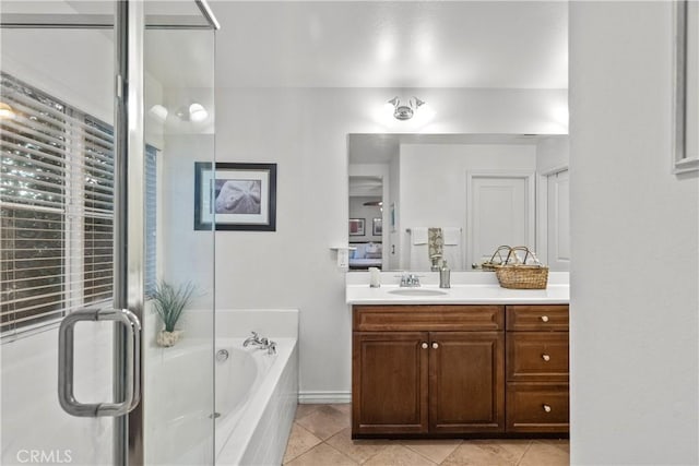 bathroom with vanity, tile patterned floors, a bath, and a stall shower