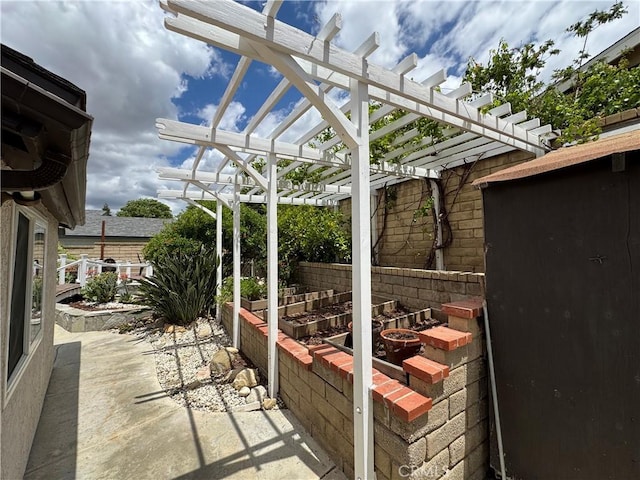 view of patio featuring a pergola