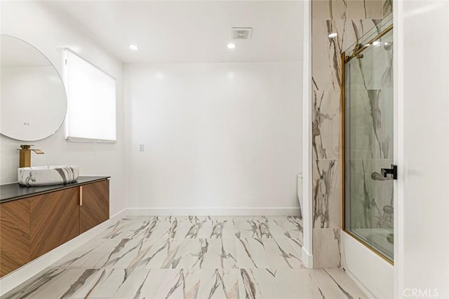 full bathroom featuring bath / shower combo with glass door, marble look tile flooring, vanity, and recessed lighting
