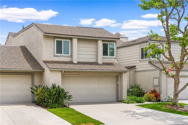 206 Eisenhower, Placentia, CA 92870 - view of front of home featuring stucco siding, driveway, a garage, and a shingled roof
