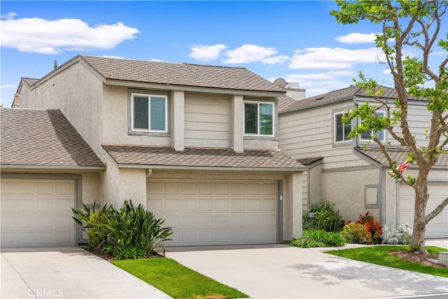206 Eisenhower, Placentia, CA 92870 - view of front facade with stucco siding, concrete driveway, a garage, and a shingled roof