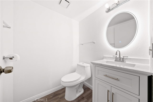 206 Eisenhower, Placentia, CA 92870 - half bath featuring toilet, wood finished floors, vanity, and baseboards