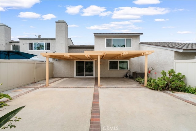 206 Eisenhower, Placentia, CA 92870 - rear view of house featuring stucco siding, a fenced backyard, and a patio area