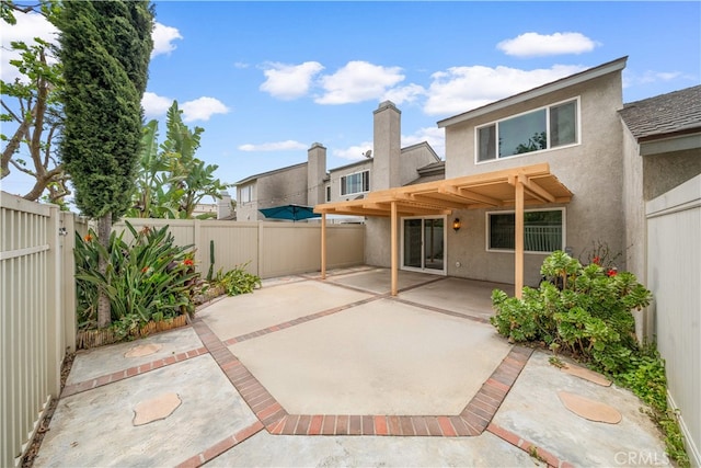 206 Eisenhower, Placentia, CA 92870 - back of house with stucco siding, a patio area, and a fenced backyard