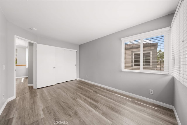 206 Eisenhower, Placentia, CA 92870 - unfurnished bedroom featuring wood finished floors, baseboards, and a closet