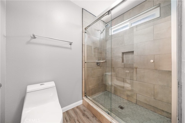 206 Eisenhower, Placentia, CA 92870 - full bath featuring wood finished floors, a stall shower, baseboards, and toilet