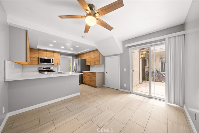 206 Eisenhower, Placentia, CA 92870 - kitchen with appliances with stainless steel finishes, baseboards, light countertops, modern cabinets, and brown cabinetry