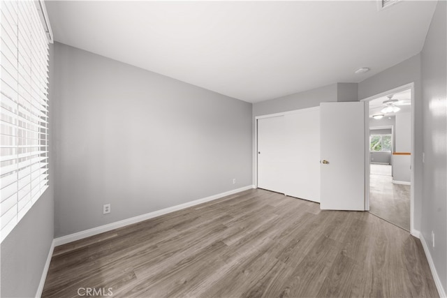 206 Eisenhower, Placentia, CA 92870 - unfurnished bedroom with wood finished floors, a closet, and baseboards