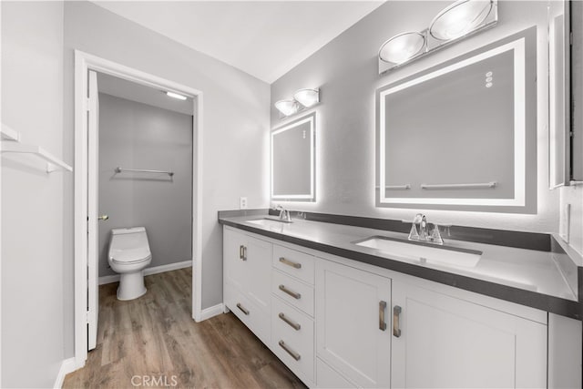 206 Eisenhower, Placentia, CA 92870 - full bathroom featuring wood finished floors, double vanity, toilet, and baseboards