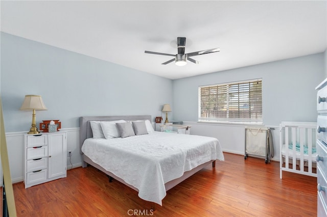bedroom featuring wood finished floors and ceiling fan
