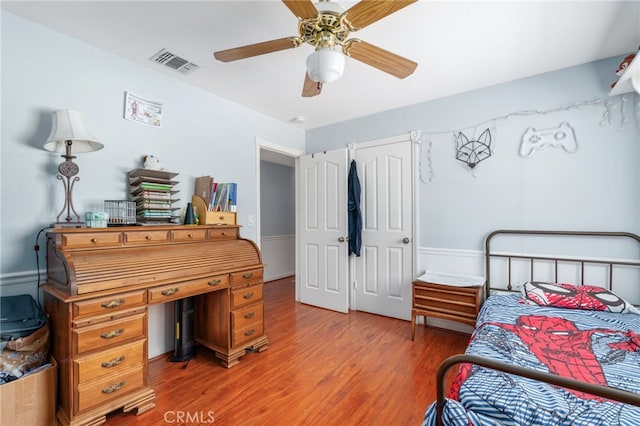 bedroom featuring light wood-type flooring and a ceiling fan