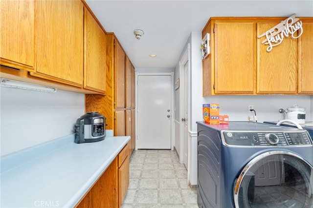 washroom featuring cabinet space, hookup for a washing machine, recessed lighting, and light floors