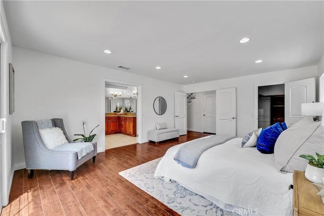 9588 Shimizu River Cir, Fountain Valley, CA 92708 - bedroom with recessed lighting, wood finished floors, baseboards, and ensuite bath