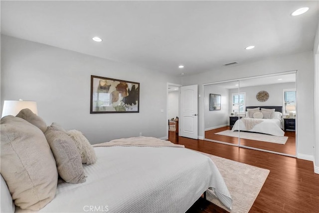 9588 Shimizu River Cir, Fountain Valley, CA 92708 - bedroom with baseboards, dark wood-style flooring, recessed lighting, and a closet