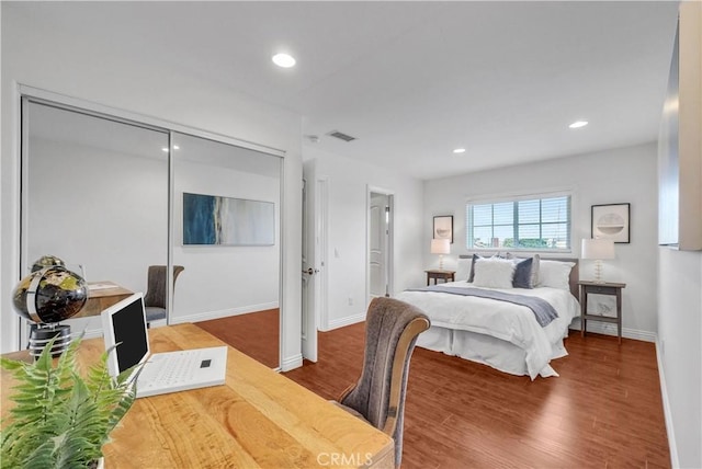 9588 Shimizu River Cir, Fountain Valley, CA 92708 - bedroom with baseboards, wood finished floors, recessed lighting, and a closet