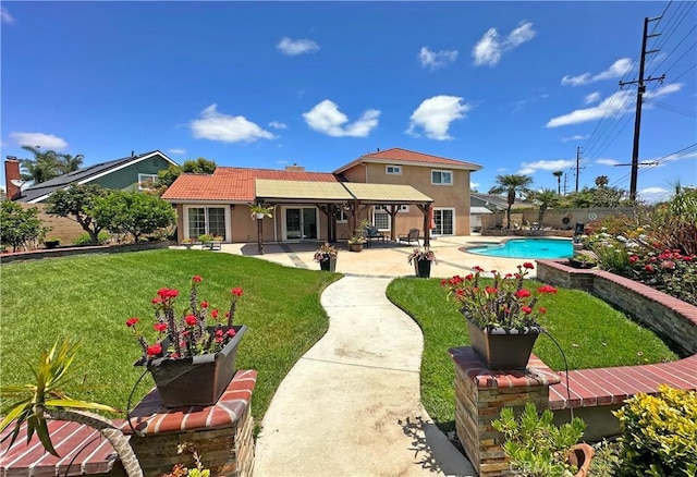 9588 Shimizu River Cir, Fountain Valley, CA 92708 - back of house with a patio area, stucco siding, a lawn, and a tiled roof