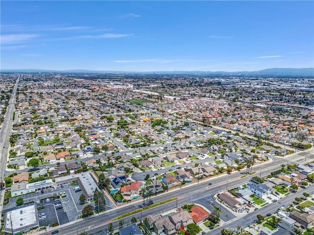 9588 Shimizu River Cir, Fountain Valley, CA 92708 - aerial overview of property's location featuring a mountain backdrop and nearby suburban area