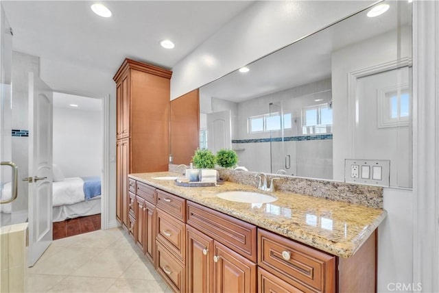 9588 Shimizu River Cir, Fountain Valley, CA 92708 - ensuite bathroom with a stall shower, tile patterned floors, double vanity, and recessed lighting