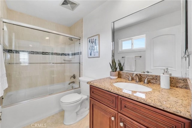 9588 Shimizu River Cir, Fountain Valley, CA 92708 - bathroom featuring toilet, vanity, shower / bath combination with glass door, and tile patterned flooring