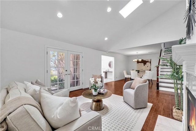 9588 Shimizu River Cir, Fountain Valley, CA 92708 - living room featuring french doors, vaulted ceiling, wood finished floors, recessed lighting, and a chandelier