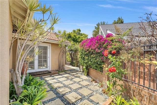 9588 Shimizu River Cir, Fountain Valley, CA 92708 - view of patio with fence and french doors