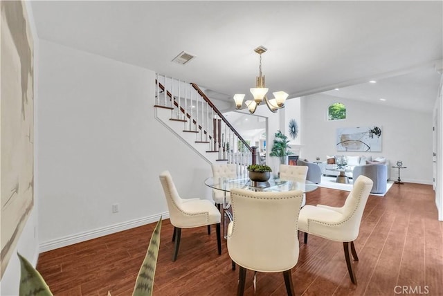 9588 Shimizu River Cir, Fountain Valley, CA 92708 - dining room with a chandelier, wood finished floors, stairs, baseboards, and vaulted ceiling