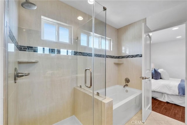 9588 Shimizu River Cir, Fountain Valley, CA 92708 - ensuite bathroom featuring a shower stall, plenty of natural light, and a tub