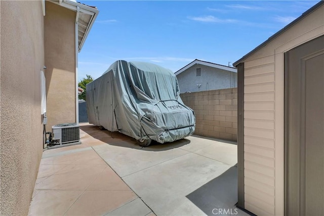 9588 Shimizu River Cir, Fountain Valley, CA 92708 - view of patio / terrace with central AC unit and fence