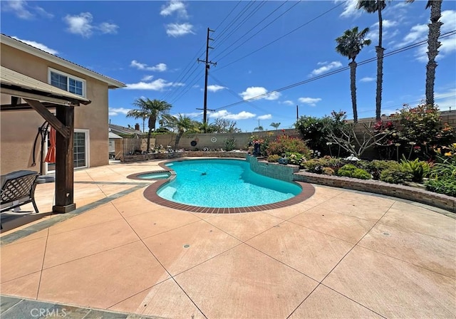 9588 Shimizu River Cir, Fountain Valley, CA 92708 - view of swimming pool featuring a patio, a fenced backyard, and a pool with connected hot tub