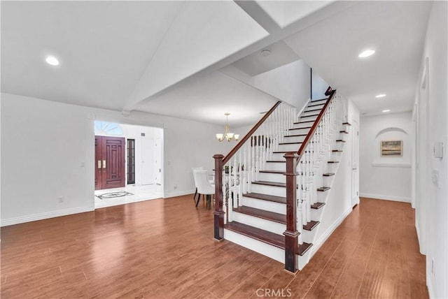 9588 Shimizu River Cir, Fountain Valley, CA 92708 - stairway with wood finished floors, baseboards, a chandelier, and recessed lighting