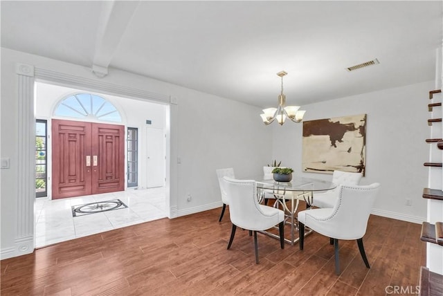 9588 Shimizu River Cir, Fountain Valley, CA 92708 - dining room with a chandelier, wood finished floors, and baseboards