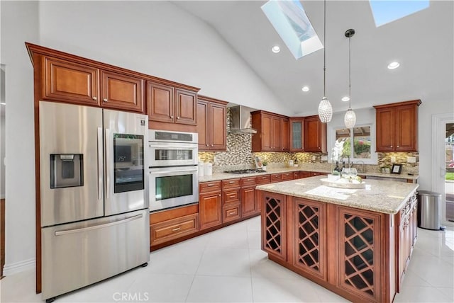9588 Shimizu River Cir, Fountain Valley, CA 92708 - kitchen featuring stainless steel appliances, lofted ceiling, backsplash, a skylight, and brown cabinets
