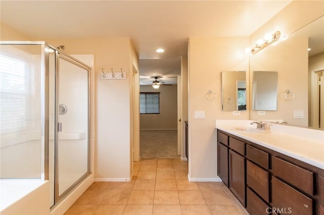 22326 Blue Lupine Cir, Grand Terrace, CA 92313 - bathroom featuring vanity, a shower stall, a ceiling fan, tile patterned floors, and baseboards