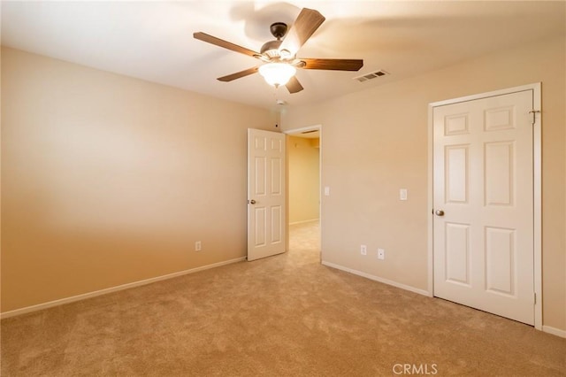 22326 Blue Lupine Cir, Grand Terrace, CA 92313 - unfurnished bedroom featuring light carpet, baseboards, and ceiling fan